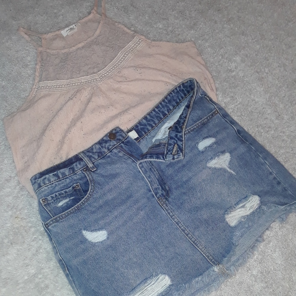 A shirt with flower pattern, and a ripped skirt